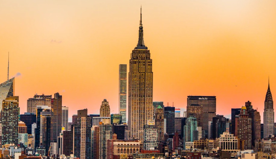The empire state building in NYC overlooking the sunset 