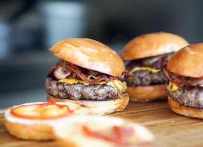 burgers inside a bun with fried onion