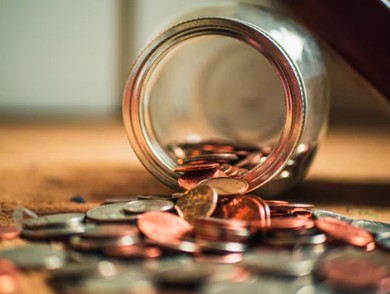 coins falling from jar